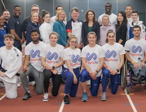 HRH with group of athletes