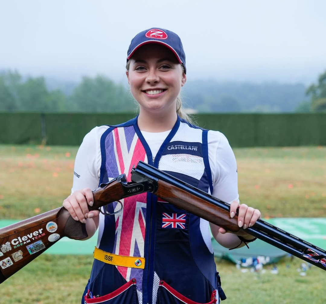 Bethany holding her gun in a safe open position